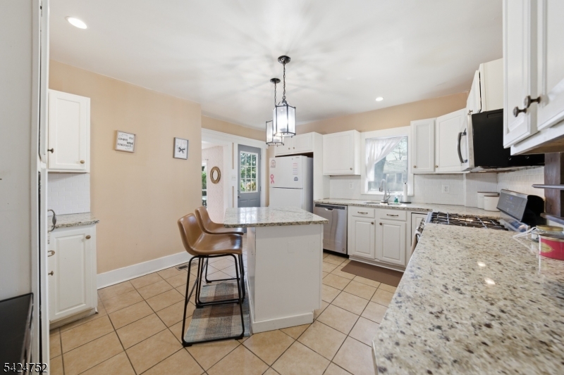 1401 Mt Holly Road Burlington, NJ 08016 - Photo 5 of 23 a kitchen with granite countertop a sink cabinets and window
