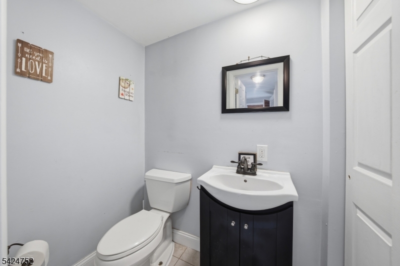 1401 Mt Holly Road Burlington, NJ 08016 - Photo 8 of 23 a bathroom with a toilet a sink and mirror