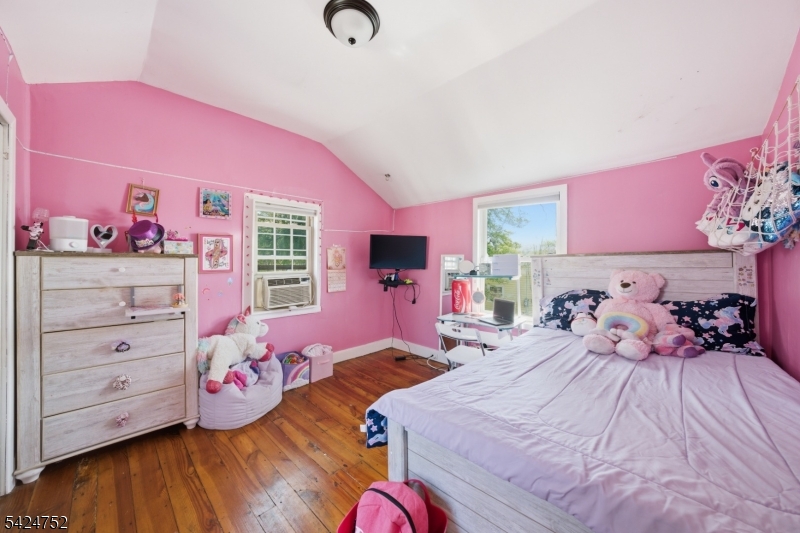 1401 Mt Holly Road Burlington, NJ 08016 - Photo 10 of 23 a bedroom with a bed and wooden floor