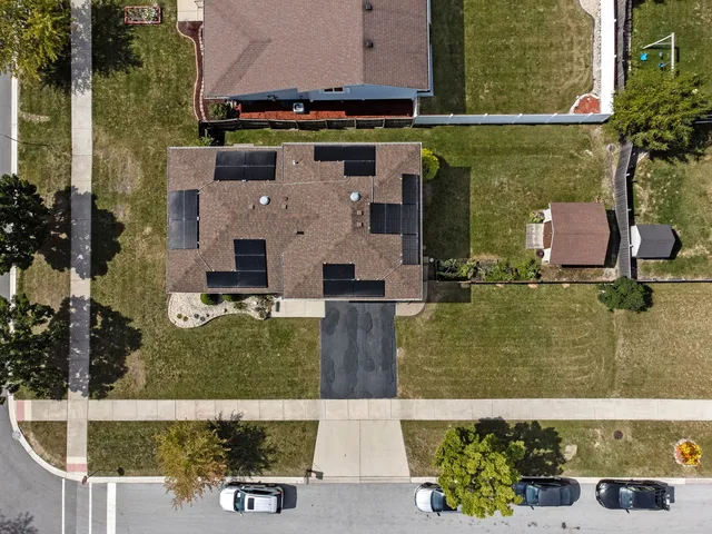aerial view of a house with a yard