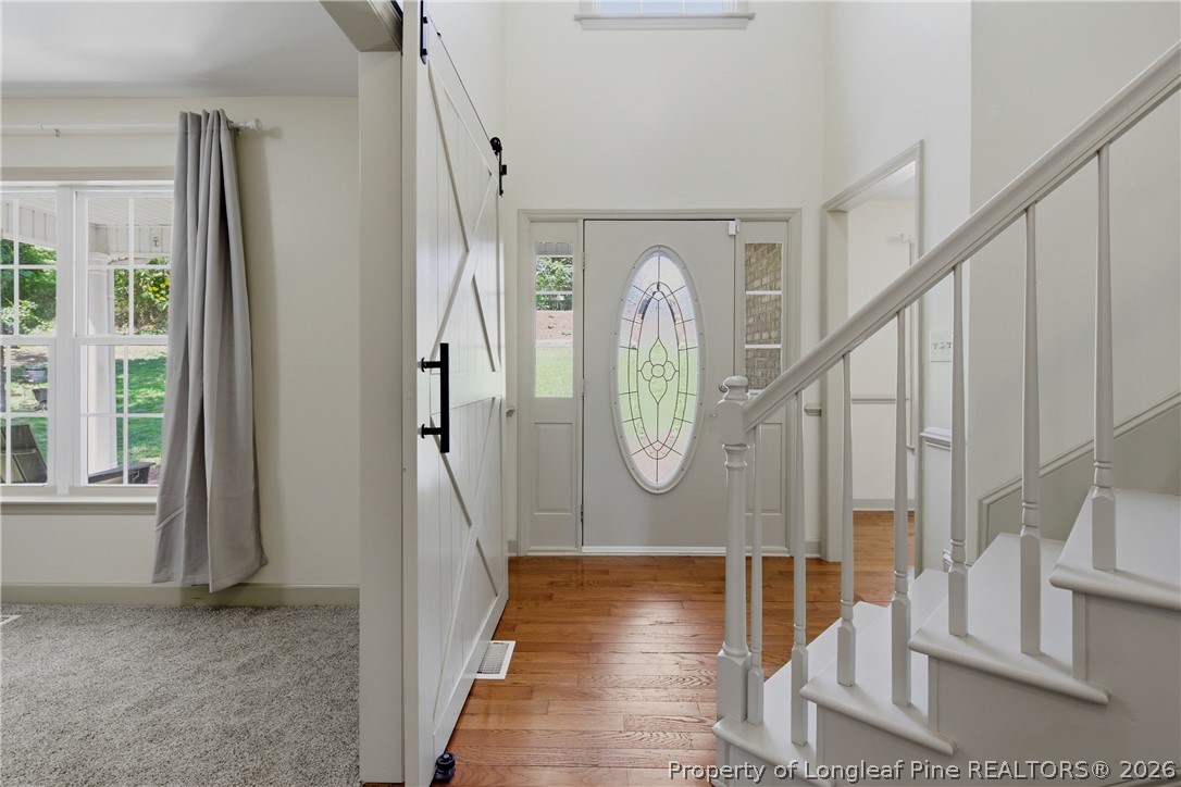 1075 Buffalo Lake Road Sanford, NC 27332 - Photo 10 of 49 a view of entryway and hall with wooden floor