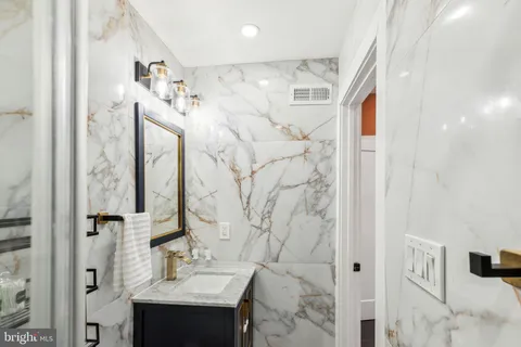 a view of hallway with stairs and a window