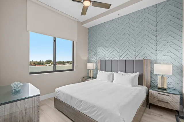 a bedroom with a bed and a table