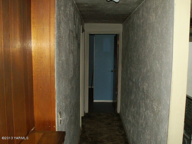 211 Ranger Road Naches, WA 98937 - Photo 8 of 16 a view of a hallway with a wooden door