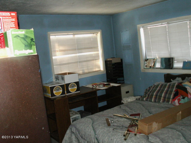 211 Ranger Road Naches, WA 98937 - Photo 9 of 16 a view of a workspace with furniture and a window