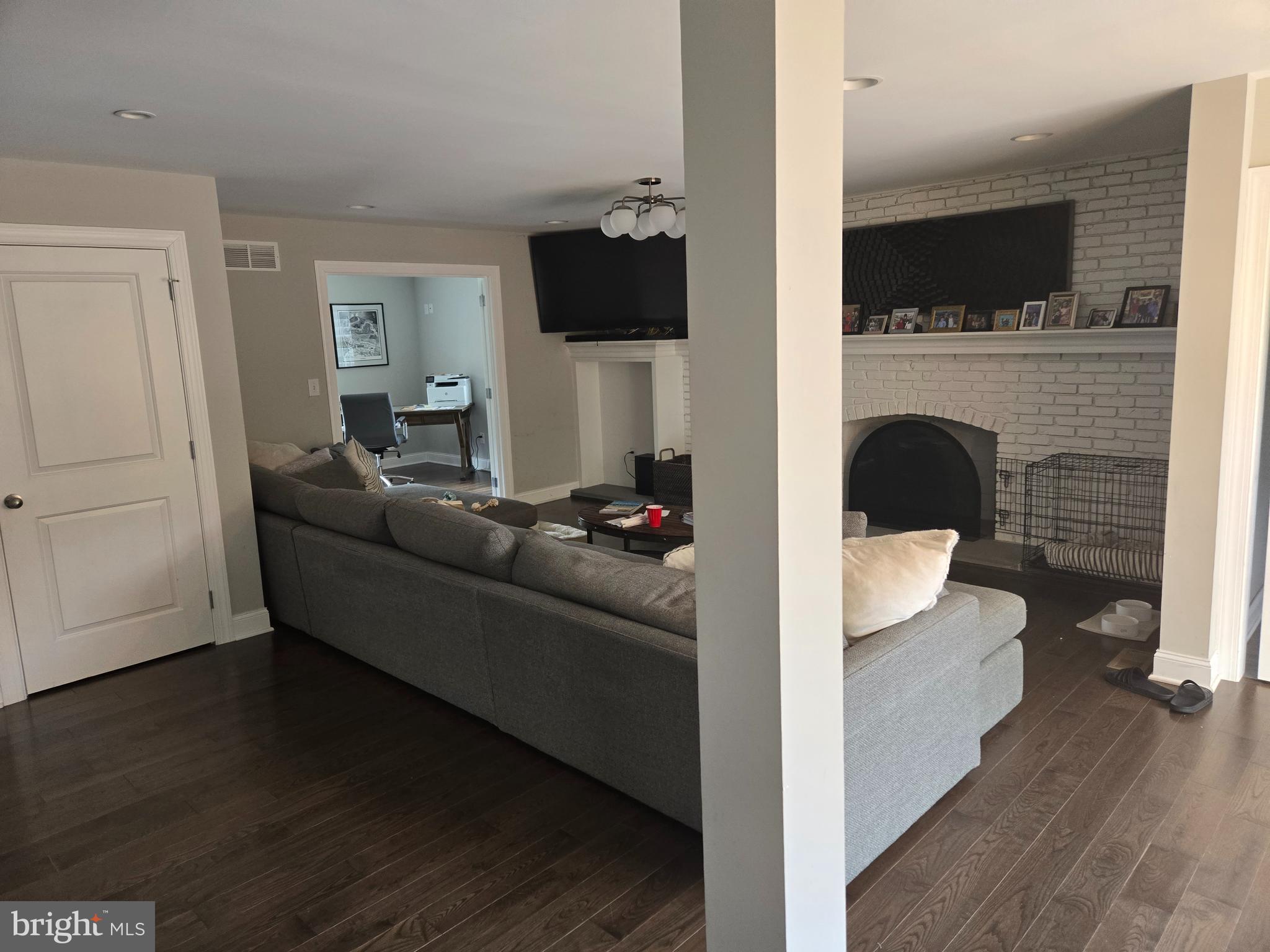 145 East Golf View Road Ardmore, PA 19003 - Photo 22 of 103 a living room with furniture and a fireplace