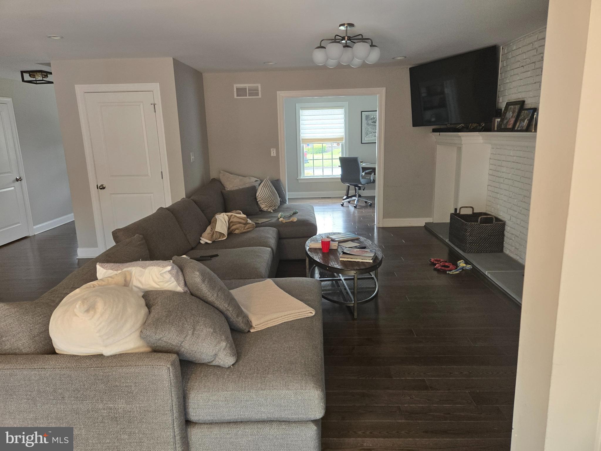 145 East Golf View Road Ardmore, PA 19003 - Photo 23 of 103 a living room with furniture and a flat screen tv