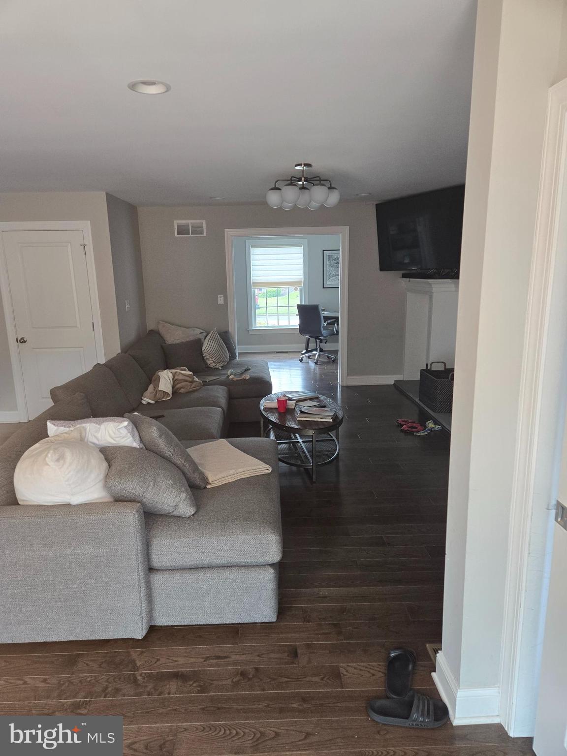145 East Golf View Road Ardmore, PA 19003 - Photo 24 of 103 a living room with furniture and a flat screen tv