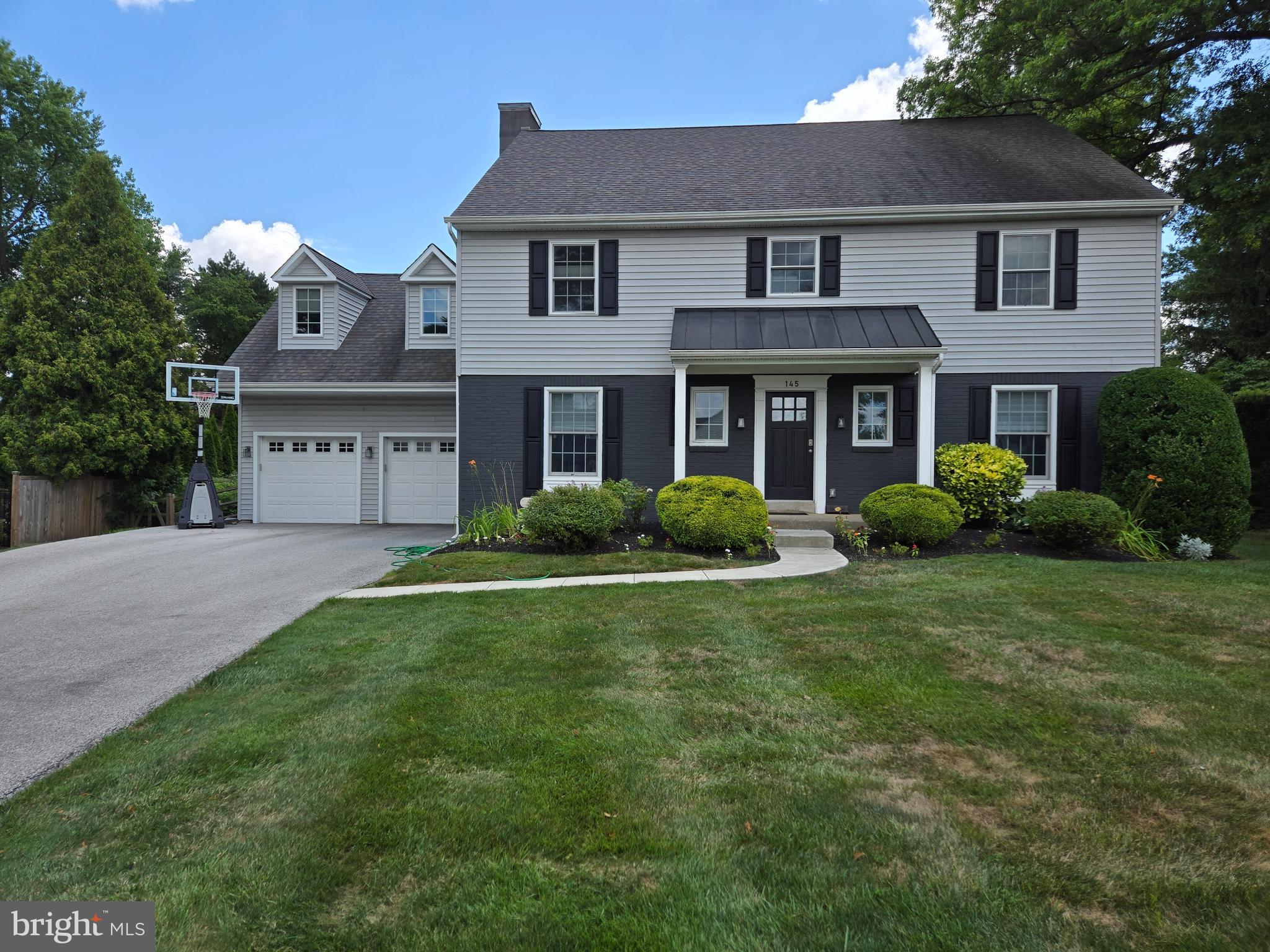 145 East Golf View Road Ardmore, PA 19003 - Photo 3 of 103 a front view of a house with a yard and trees
