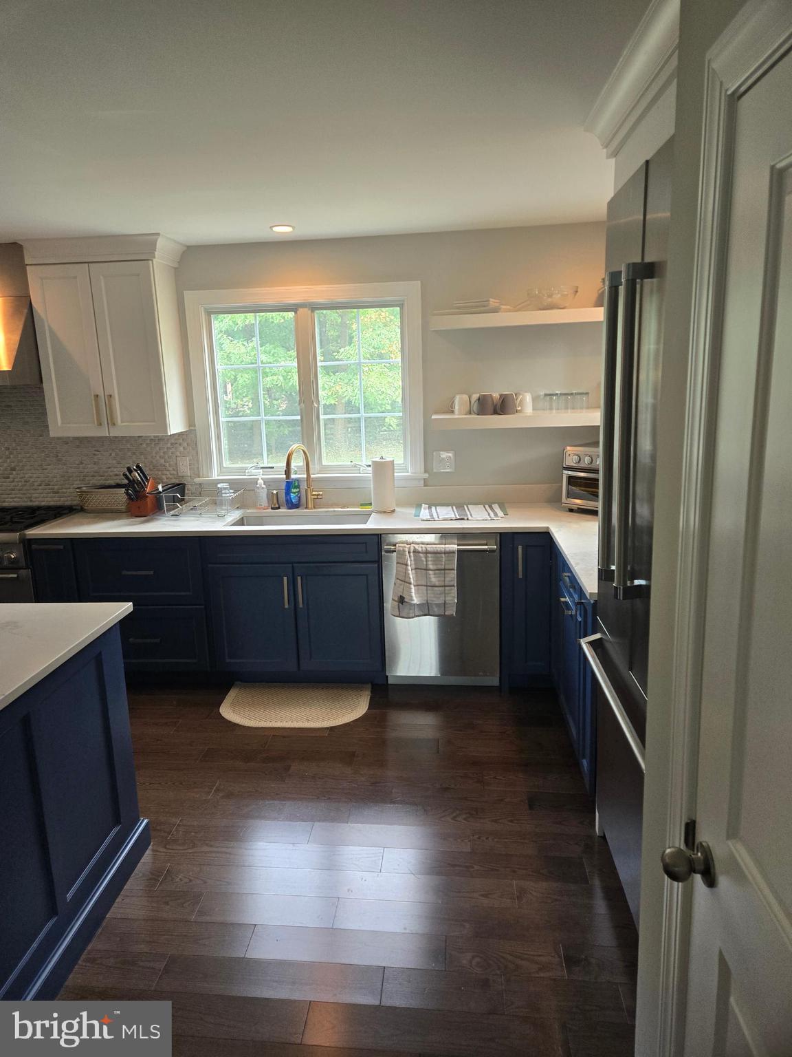 145 East Golf View Road Ardmore, PA 19003 - Photo 33 of 103 a kitchen with a sink stove and refrigerator