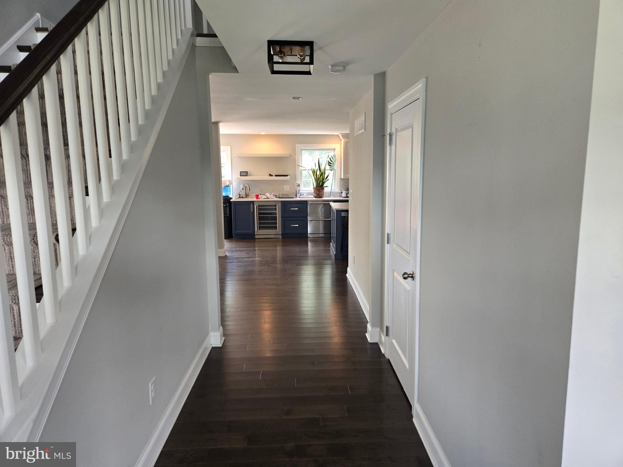 145 East Golf View Road Ardmore, PA 19003 - Photo 42 of 103 a hallway with wooden floor windows and stairs