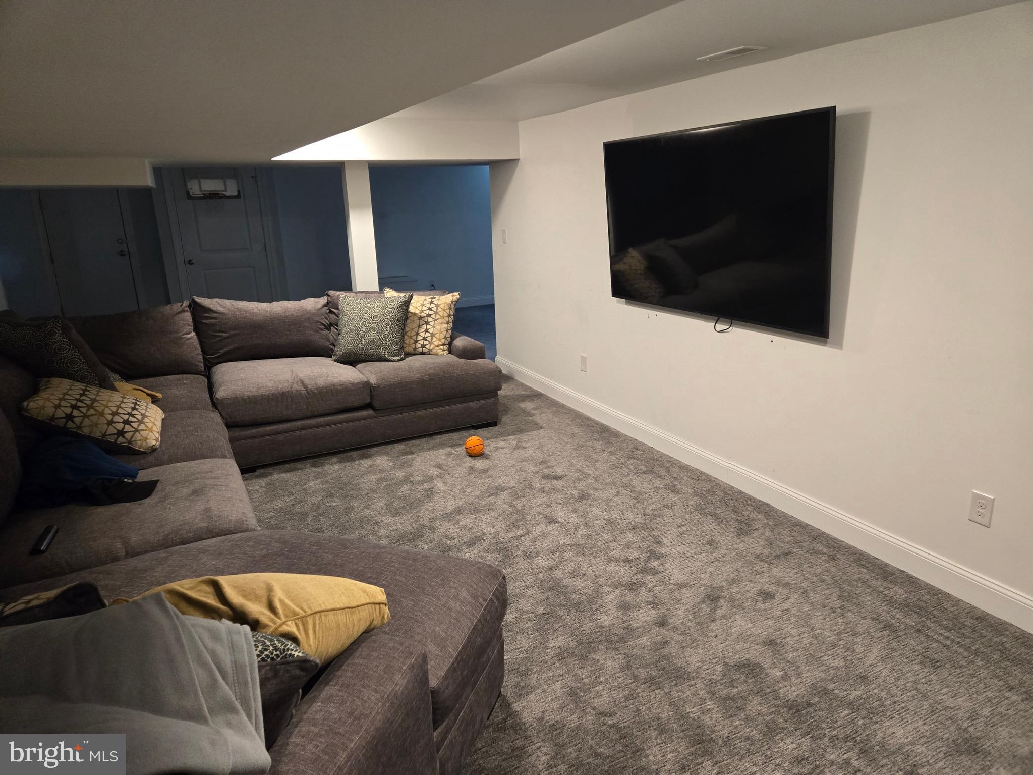145 East Golf View Road Ardmore, PA 19003 - Photo 48 of 103 a living room with furniture and a flat screen tv