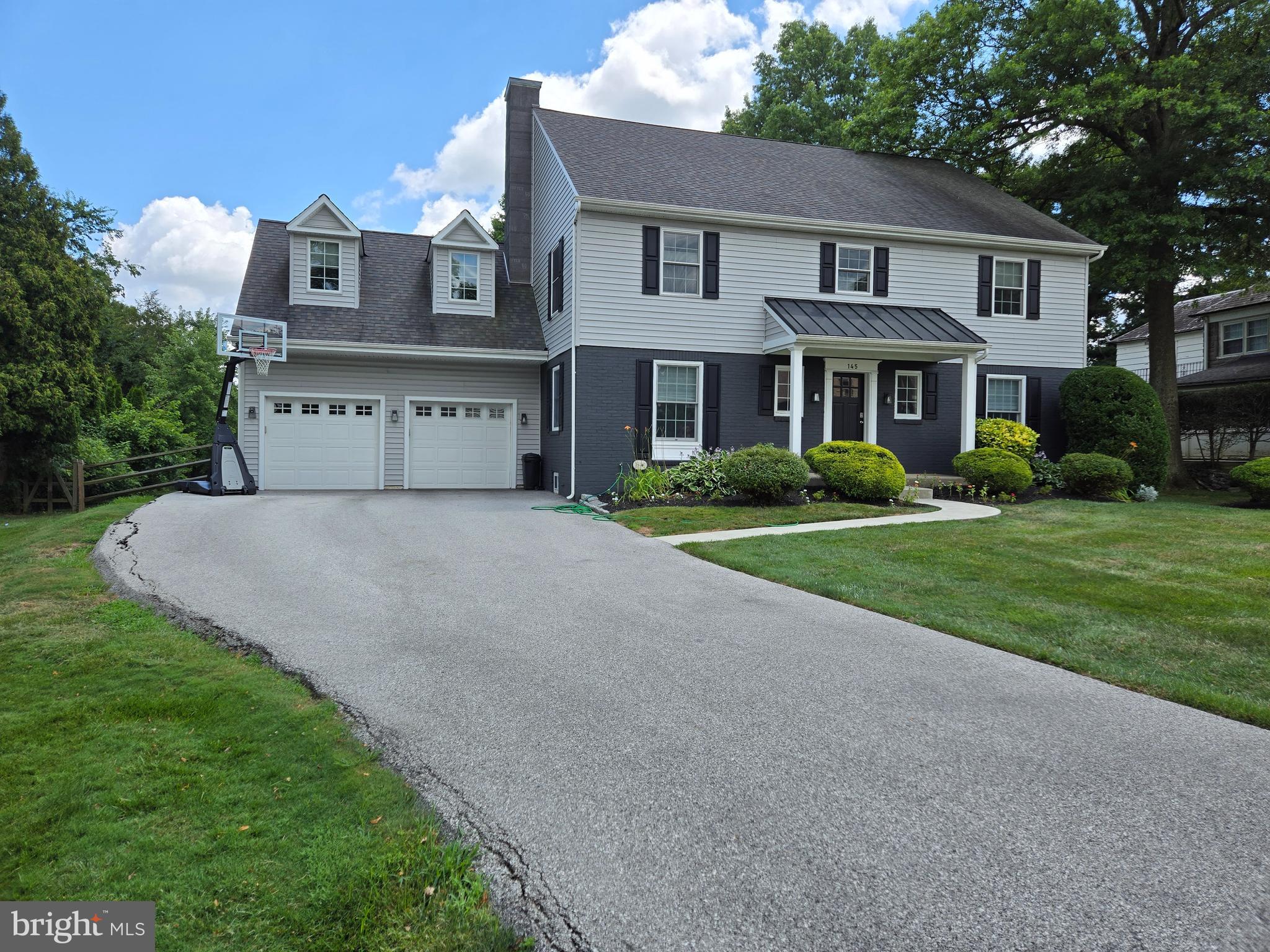 145 East Golf View Road Ardmore, PA 19003 - Photo 7 of 103 a front view of a house with a yard and trees