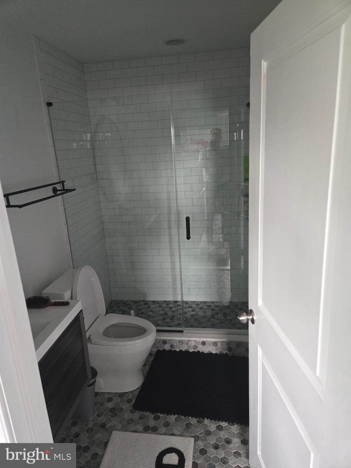 145 East Golf View Road Ardmore, PA 19003 - Photo 76 of 103 a bathroom with a granite countertop toilet and a shower