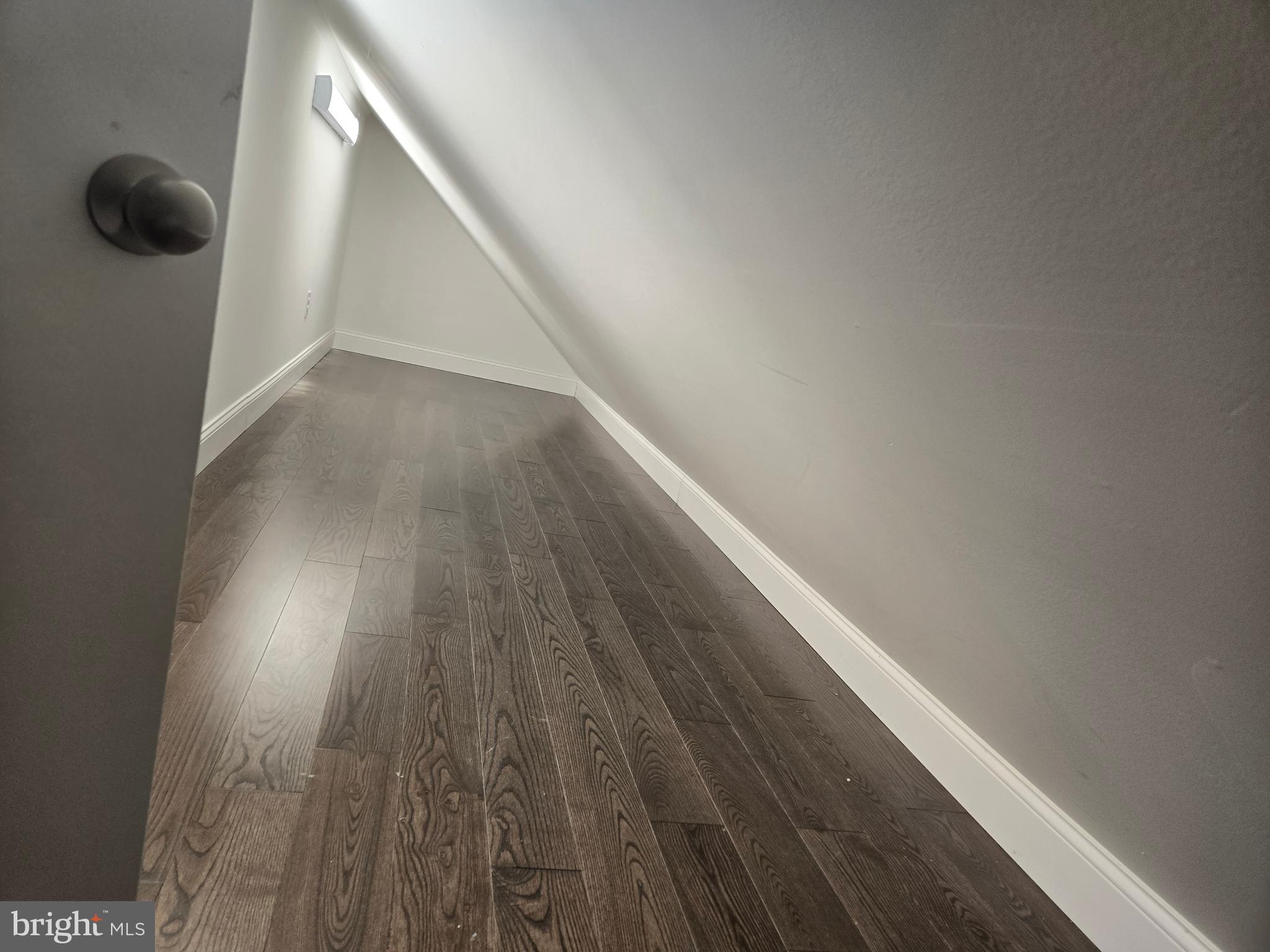 145 East Golf View Road Ardmore, PA 19003 - Photo 91 of 103 a view of empty room with wooden floor and fan