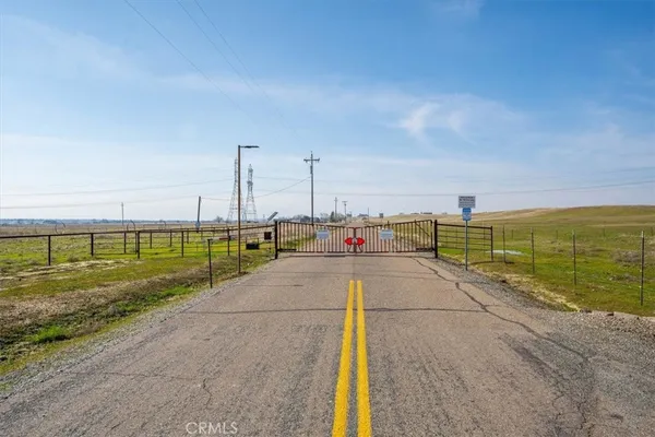 a view of a street with an ocean view