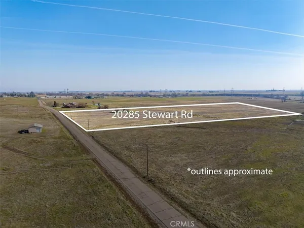 a view of a swimming pool with an outdoor seating