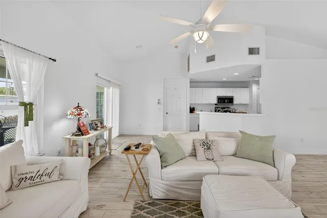 a view of a porch with furniture and front door