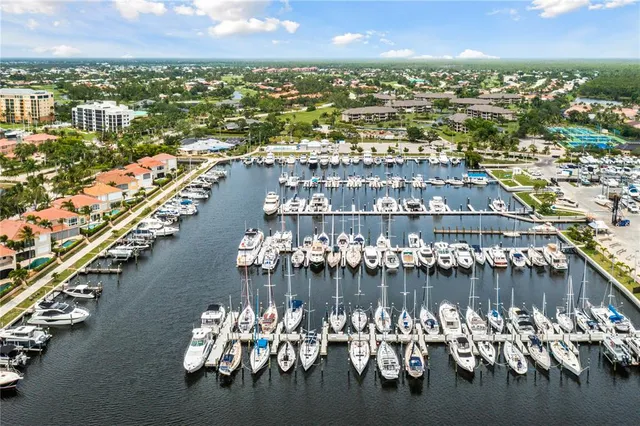 an aerial view of a city with lots of residential buildings lake and ocean view
