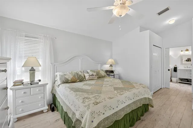 a view of a house with a yard and a fountain