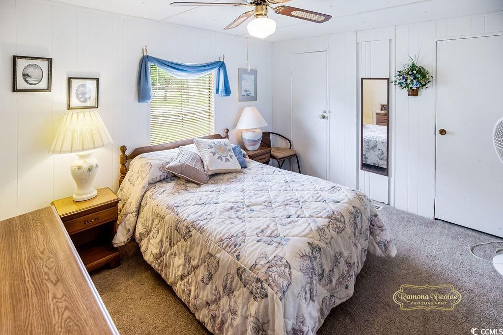 298 Flamingo Surfside Beach, SC 29575 - Photo 16 of 27 Bedroom featuring carpet, a ceiling fan, and multiple closets