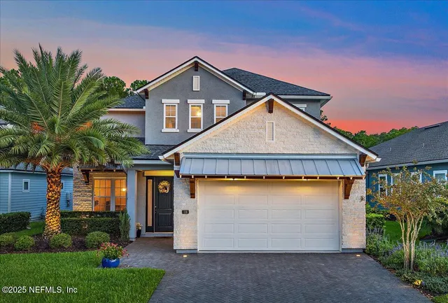 a view of a front door and a potted plant