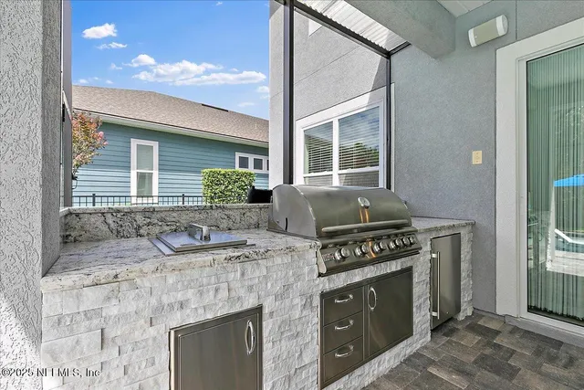 an aerial view of a house with a ocean view