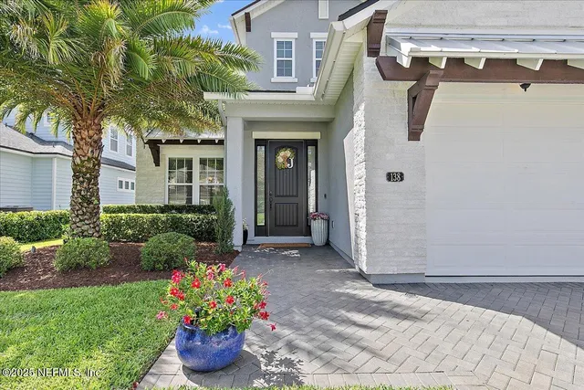 a living room with furniture ceiling fan and a window
