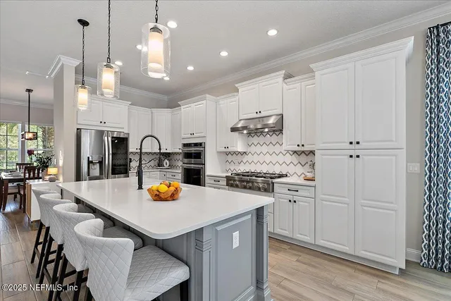 a view of a patio with a dining table and chairs