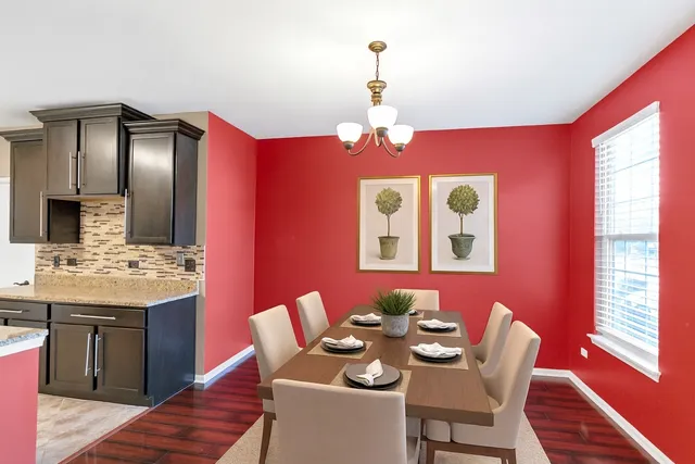 a dining room with furniture and window