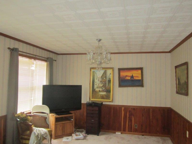 151 Cleveland Street Ripley, TN 38063 - Photo 10 of 16 a living room with furniture and a flat screen tv