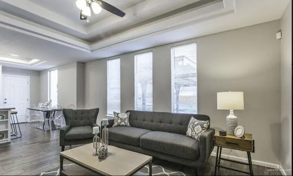 a living room with furniture and a large window
