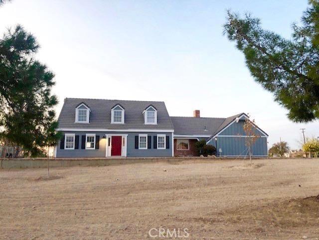 19584 Shoshonee Road Apple Valley, CA 92307 - Photo 1 of 1 a front view of a house with a yard