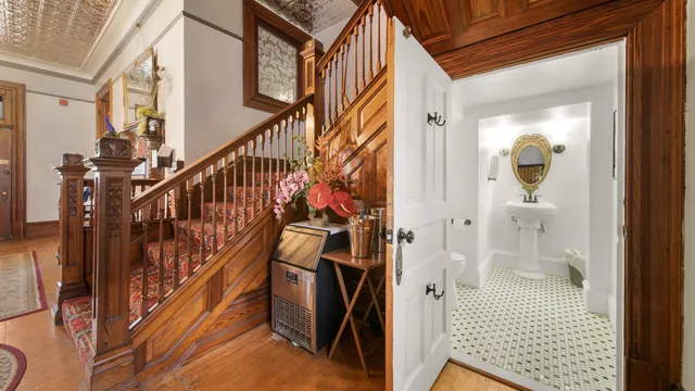 a view of an entryway with wooden floor and windows