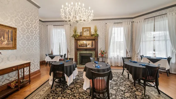 a view of a dining room with furniture window and outside view