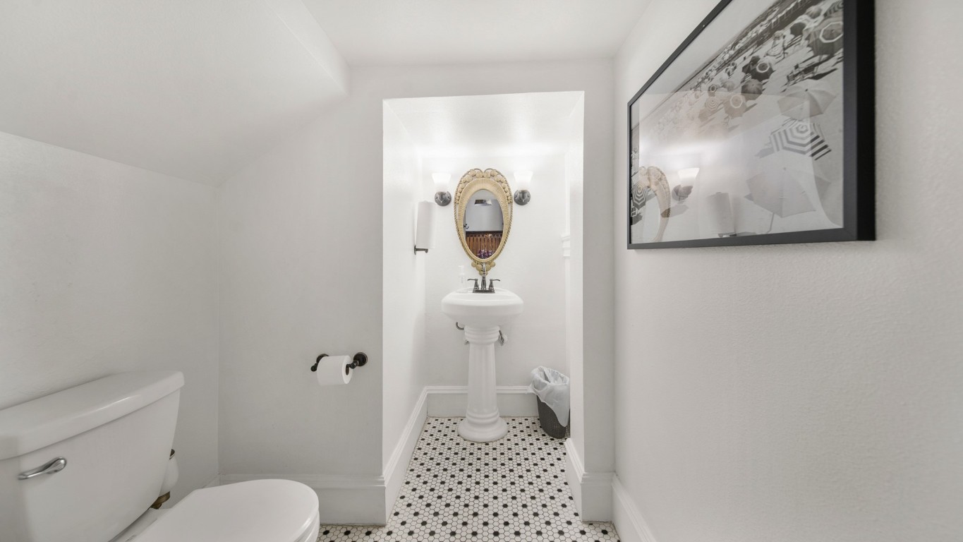 511 17th Street Galveston, TX 77550 - Photo 24 of 30 a bathroom with a toilet and a view of bathroom