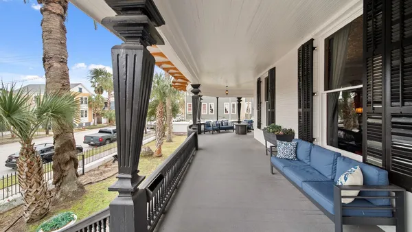 a lobby with furniture and floor to ceiling window
