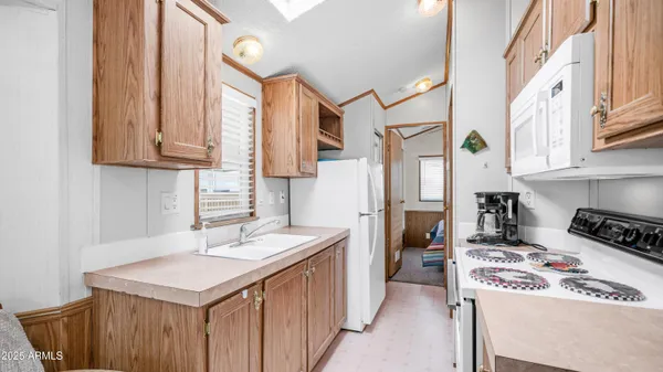 a kitchen with a stove and a refrigerator