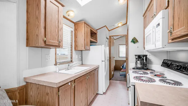 a kitchen with a stove and a refrigerator