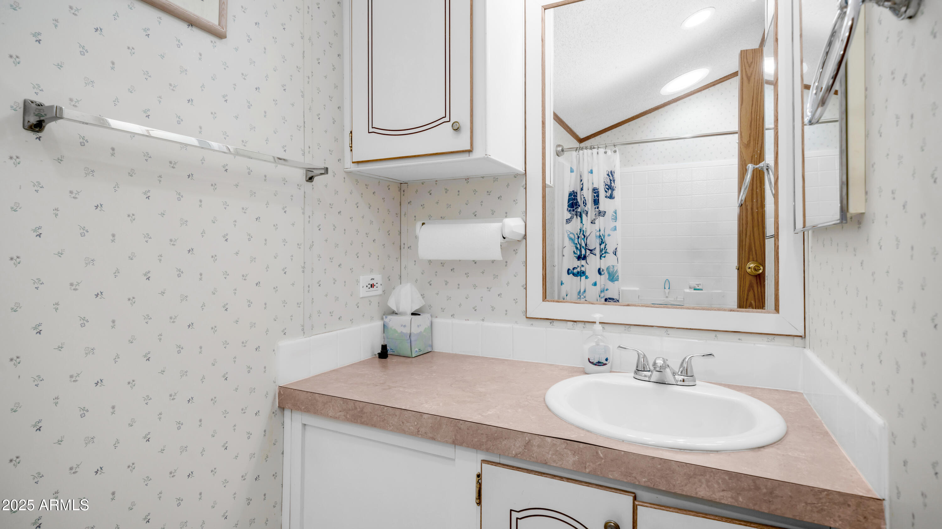 579 Jasper Drive, Unit 579 Apache Junction, AZ 85119 - Photo 18 of 56 a bathroom with a sink and a mirror