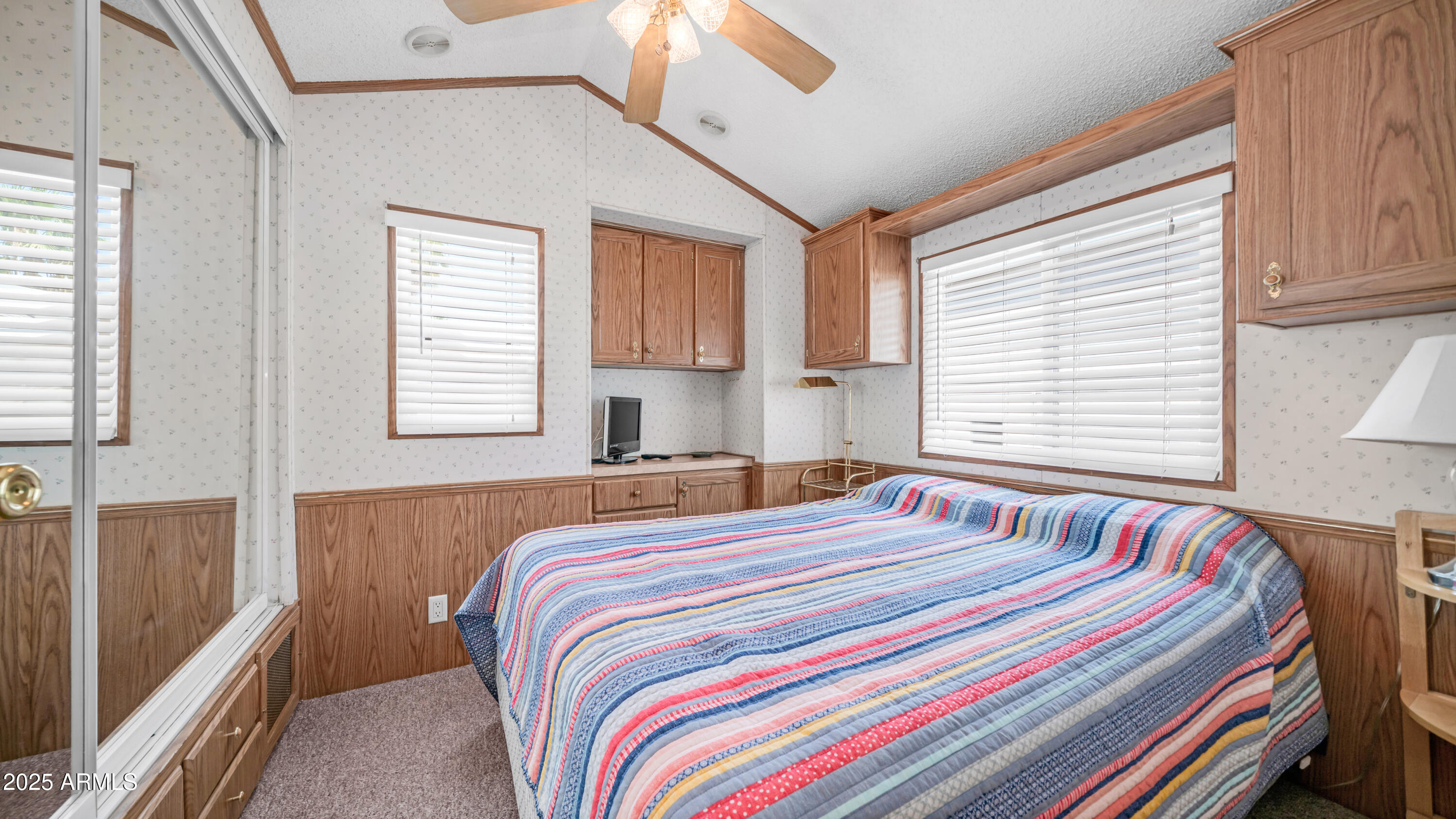 579 Jasper Drive, Unit 579 Apache Junction, AZ 85119 - Photo 20 of 56 a bedroom with a bed and a window
