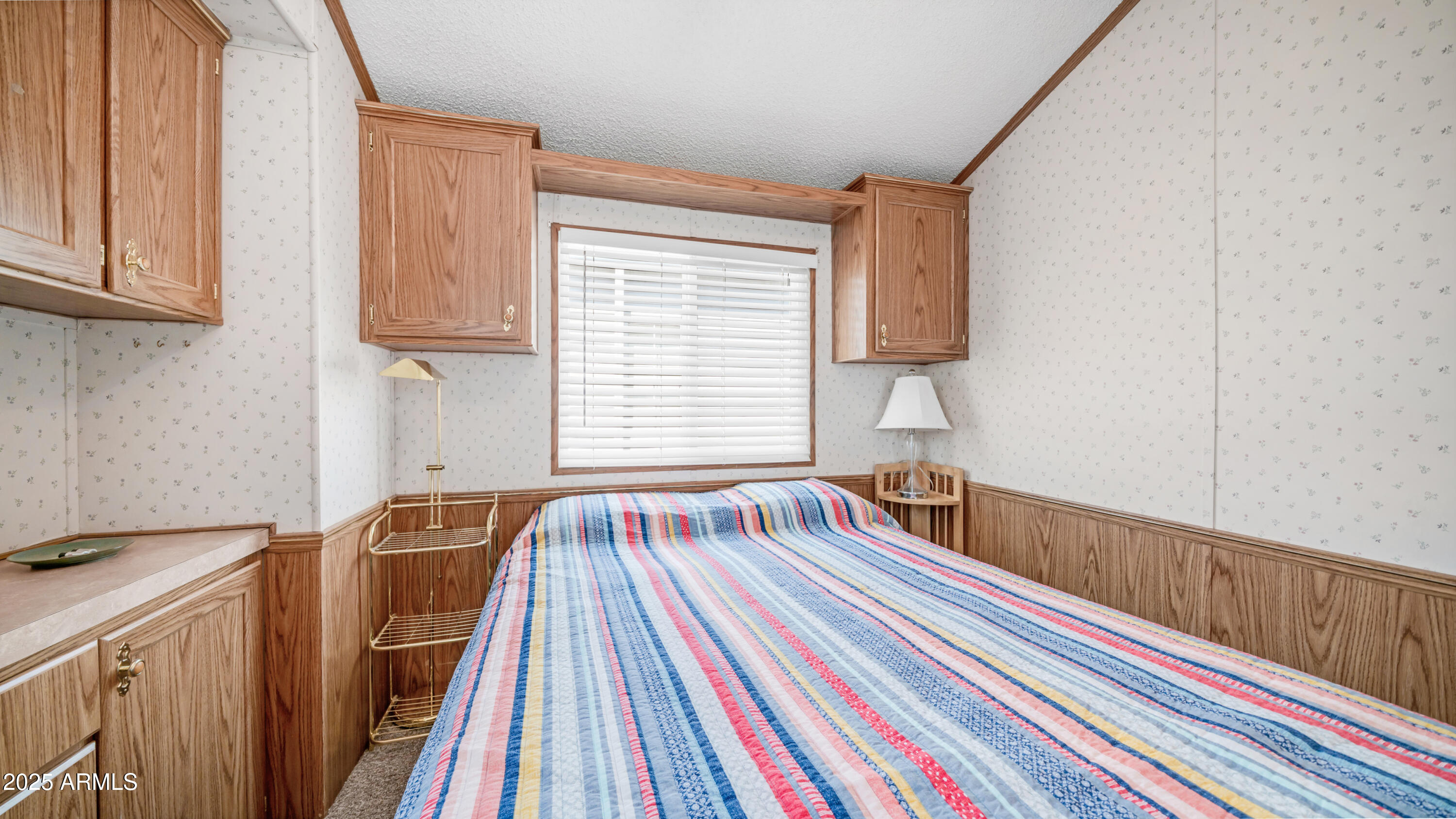 579 Jasper Drive, Unit 579 Apache Junction, AZ 85119 - Photo 21 of 56 a bed room with a bed and a window