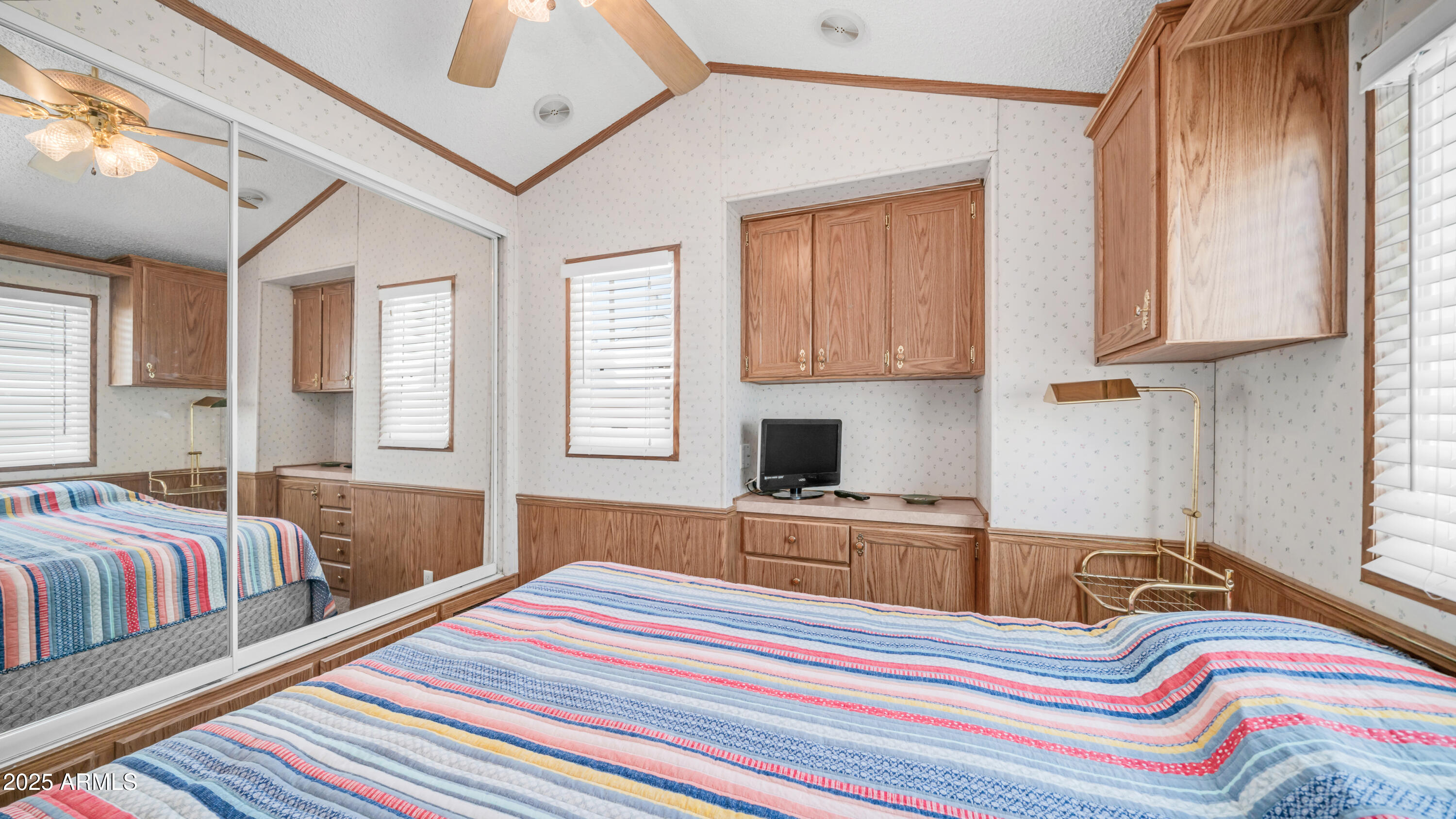 579 Jasper Drive, Unit 579 Apache Junction, AZ 85119 - Photo 22 of 56 a bedroom with a bed and wooden floor