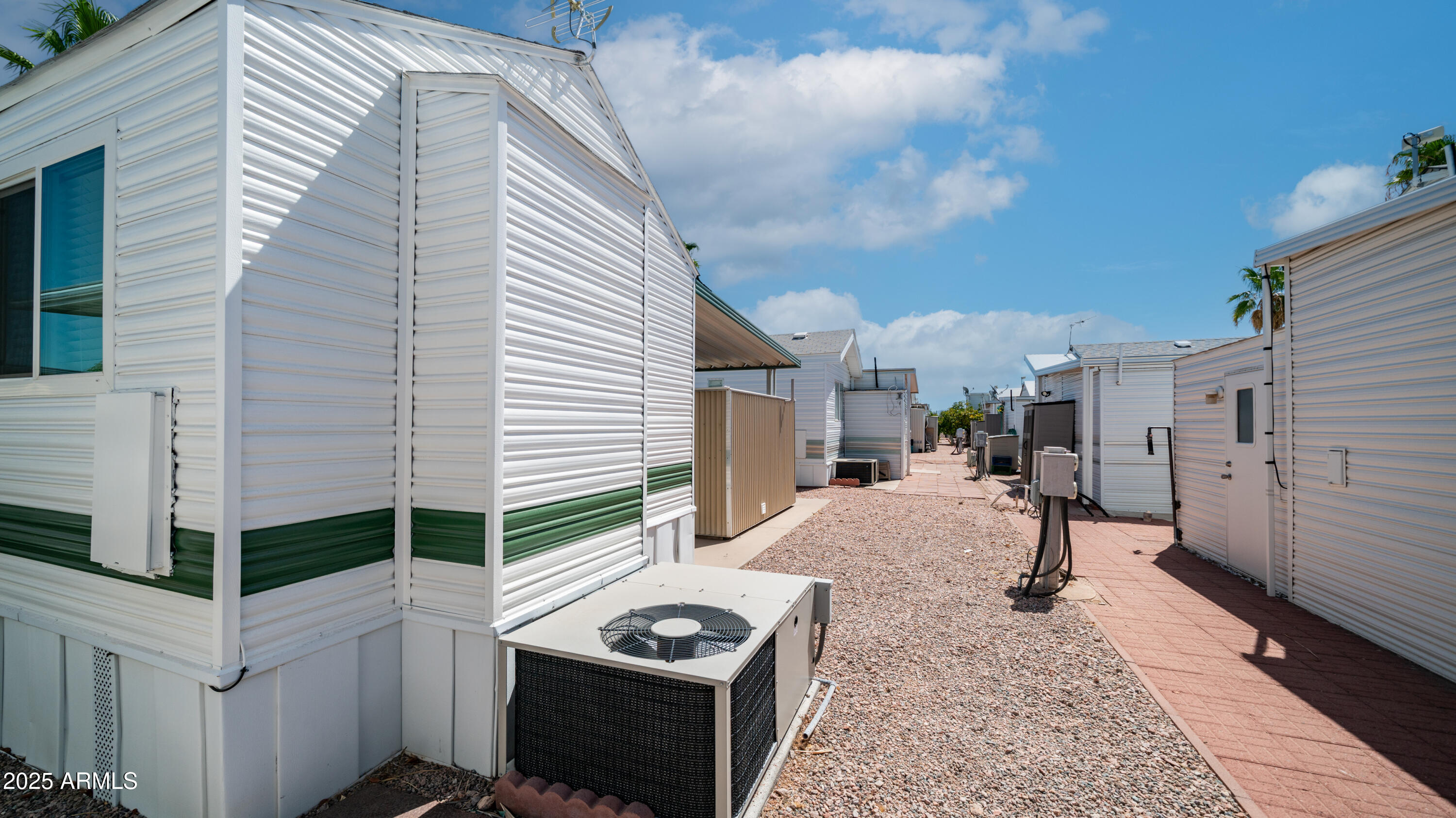 579 Jasper Drive, Unit 579 Apache Junction, AZ 85119 - Photo 25 of 56 a view of a house with backyard and sitting area