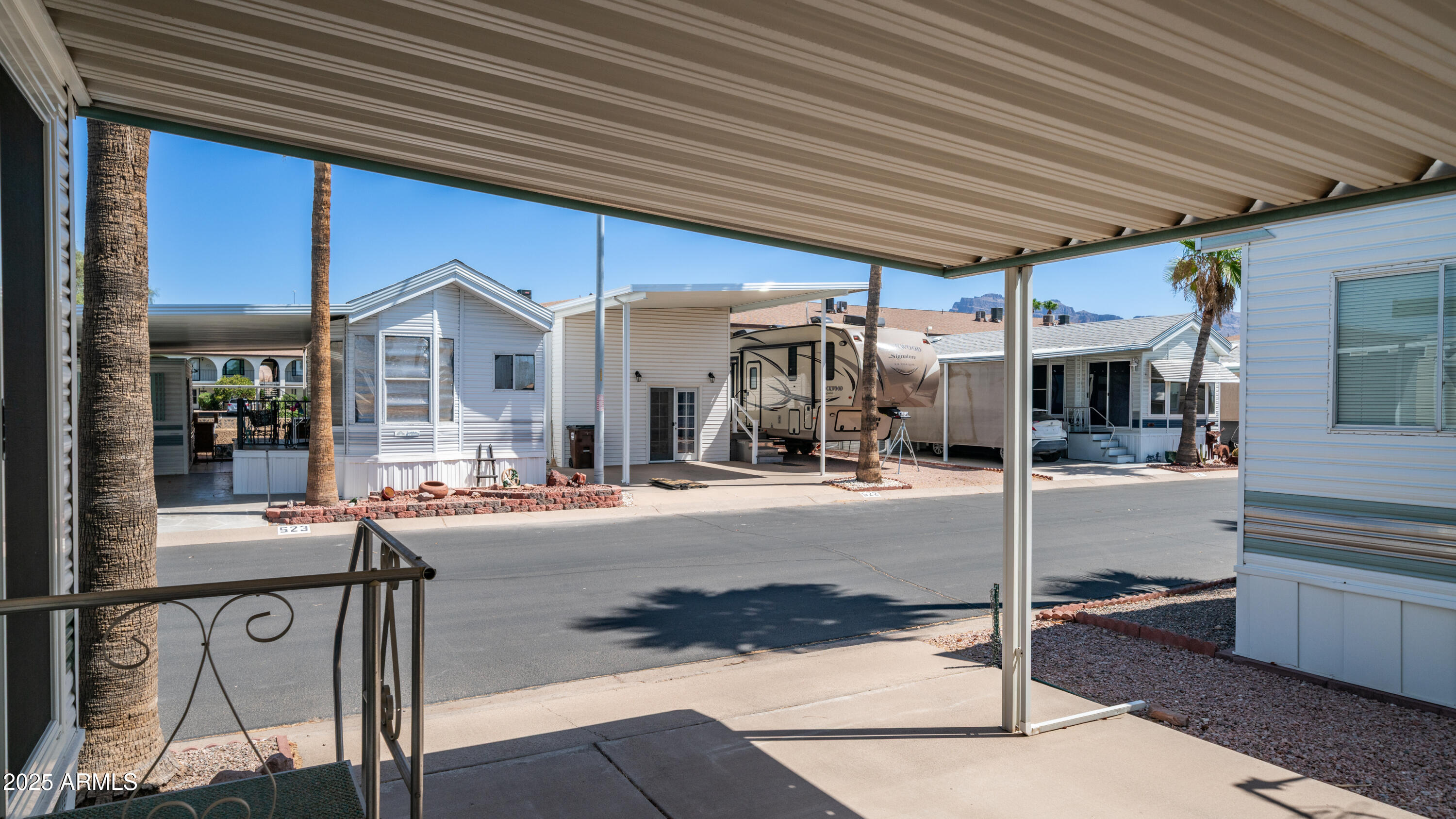 579 Jasper Drive, Unit 579 Apache Junction, AZ 85119 - Photo 7 of 56 a view of a house with tub and chairs