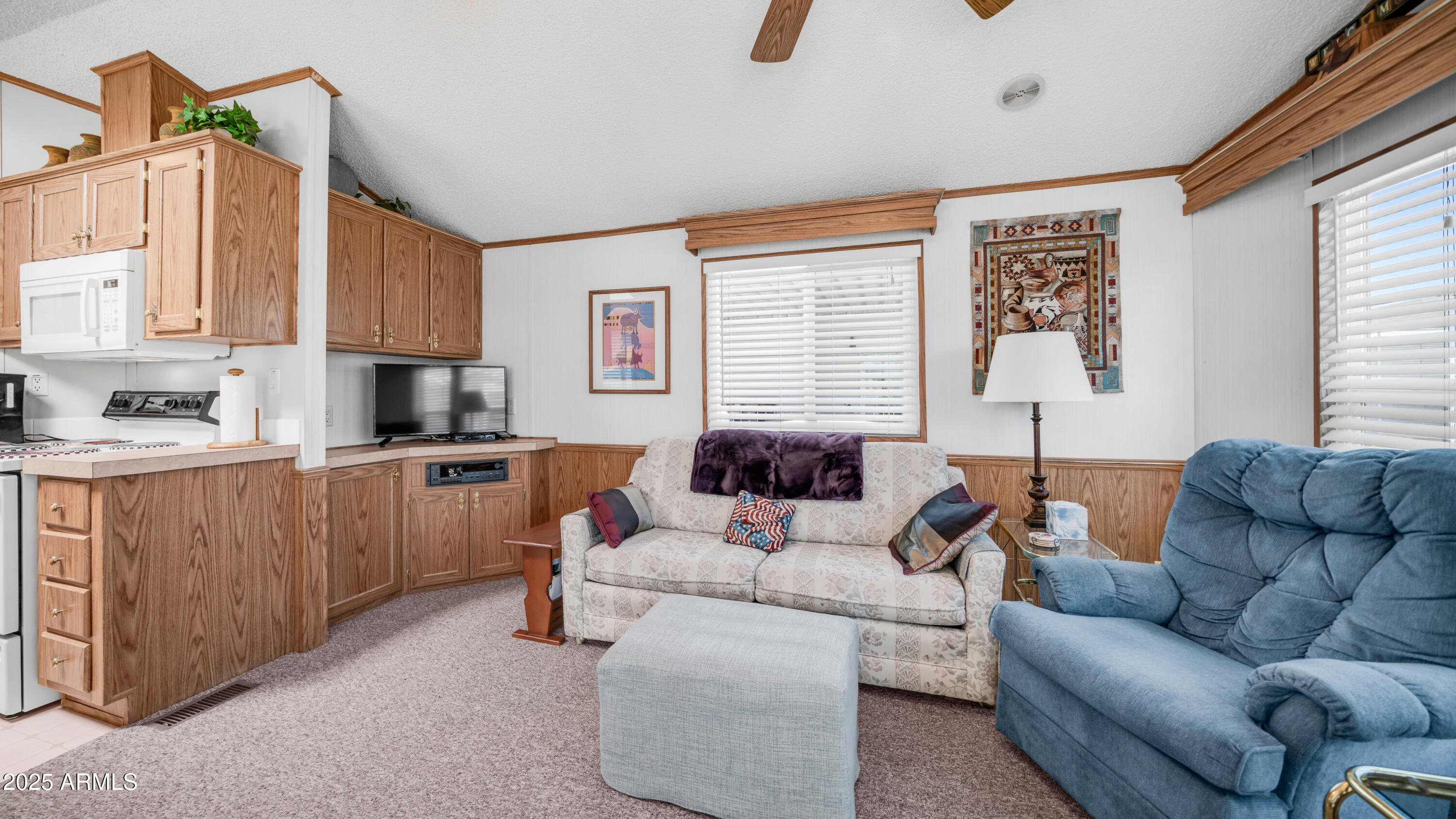 579 Jasper Drive, Unit 579 Apache Junction, AZ 85119 - Photo 10 of 56 a living room with furniture and a window