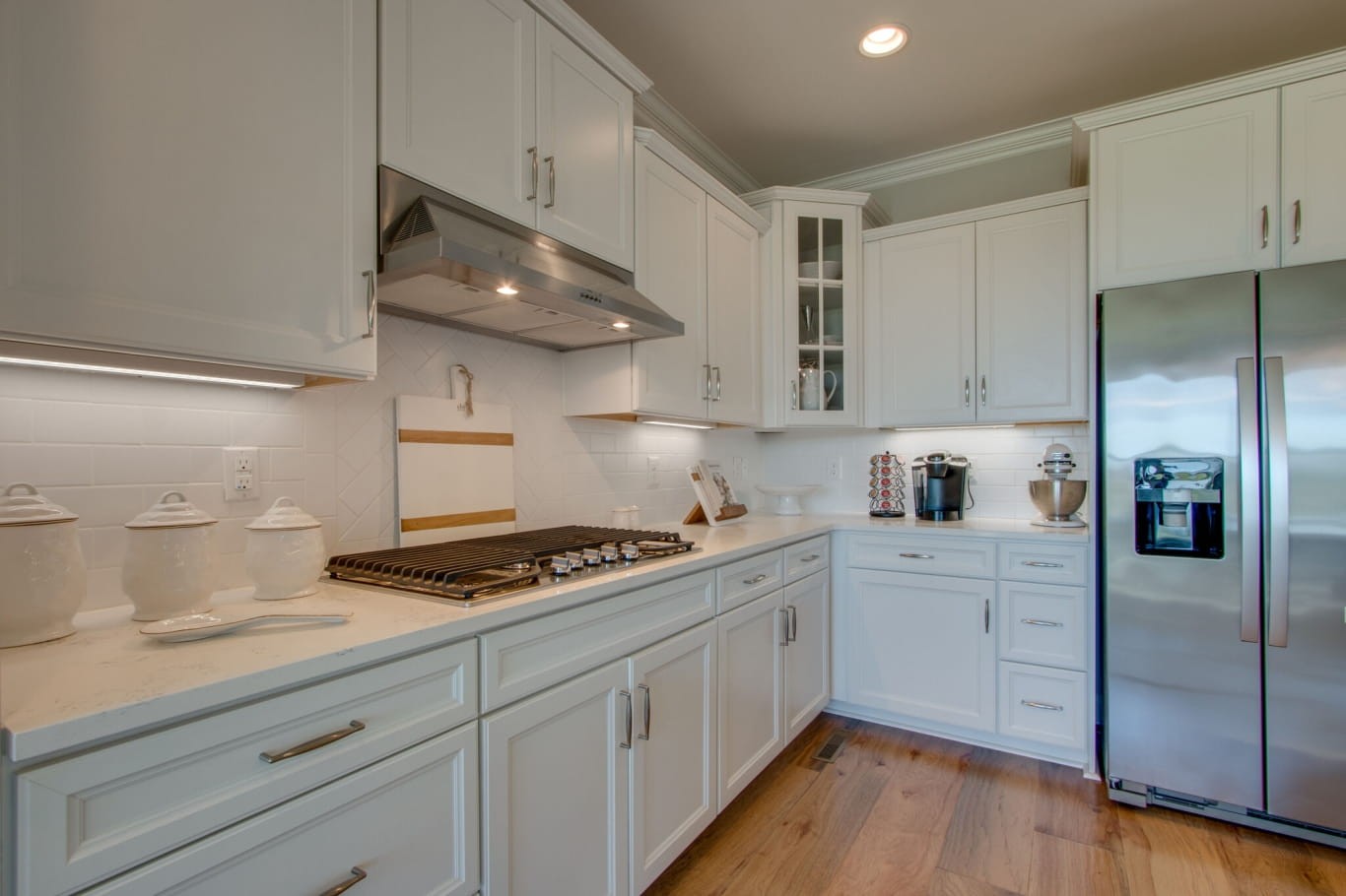 3584 Robbins Nest Road Thompson's Station, TN 37179 - Photo 18 of 43 a kitchen with stainless steel appliances a stove a sink and cabinets