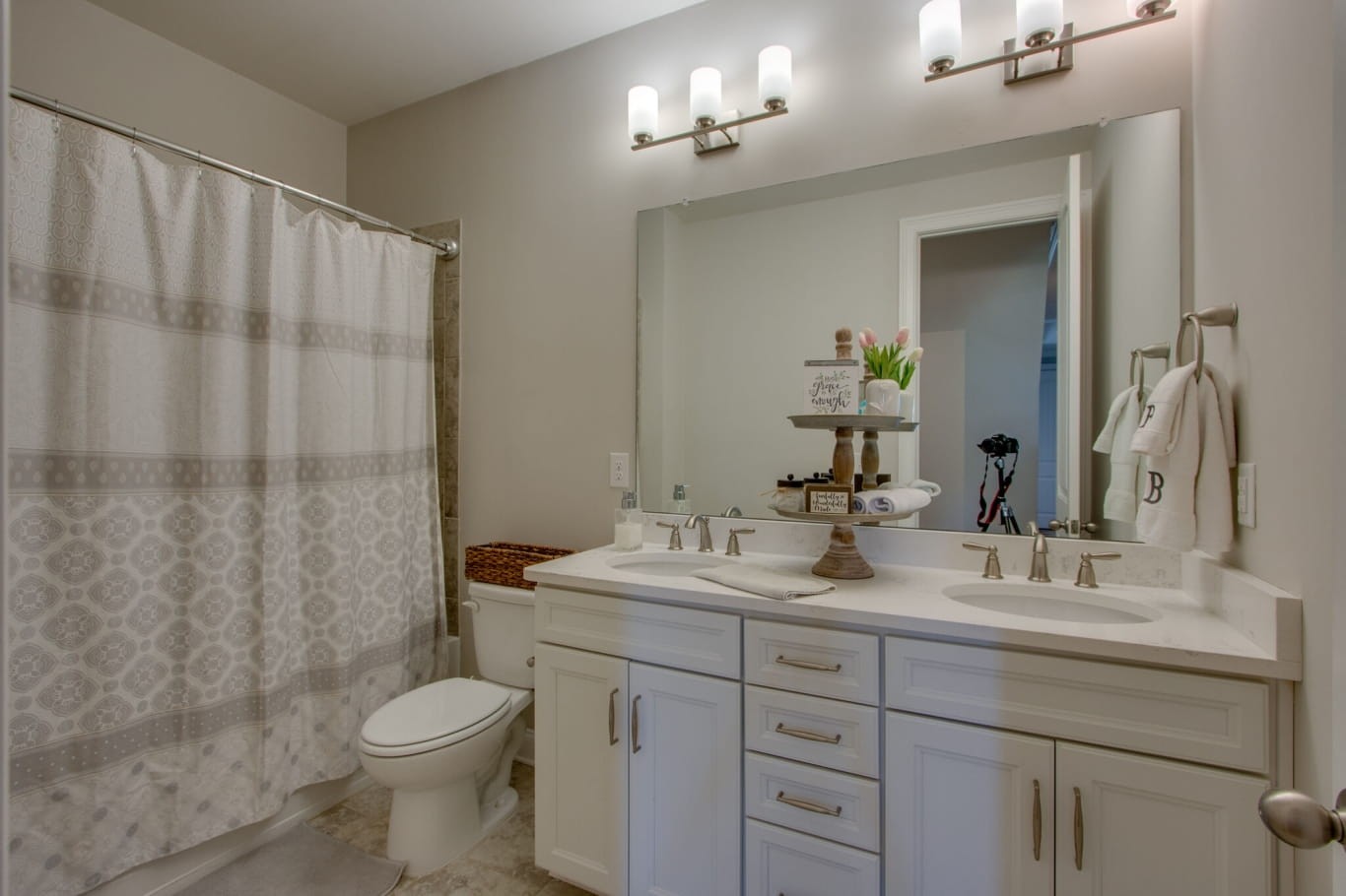 3584 Robbins Nest Road Thompson's Station, TN 37179 - Photo 31 of 43 a bathroom with a double vanity sink toilet and a mirror