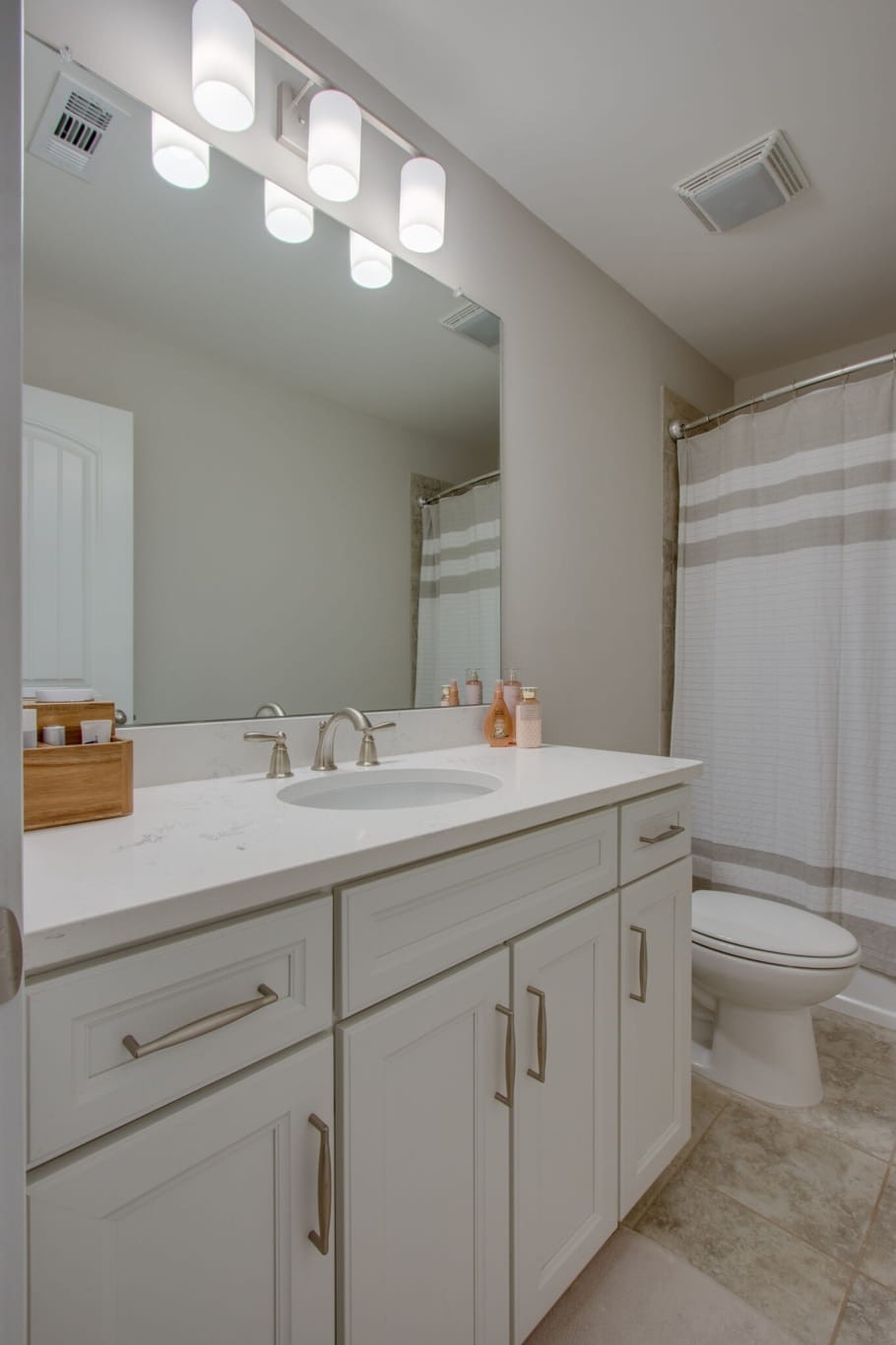 3584 Robbins Nest Road Thompson's Station, TN 37179 - Photo 39 of 43 a bathroom with a toilet a sink and mirror