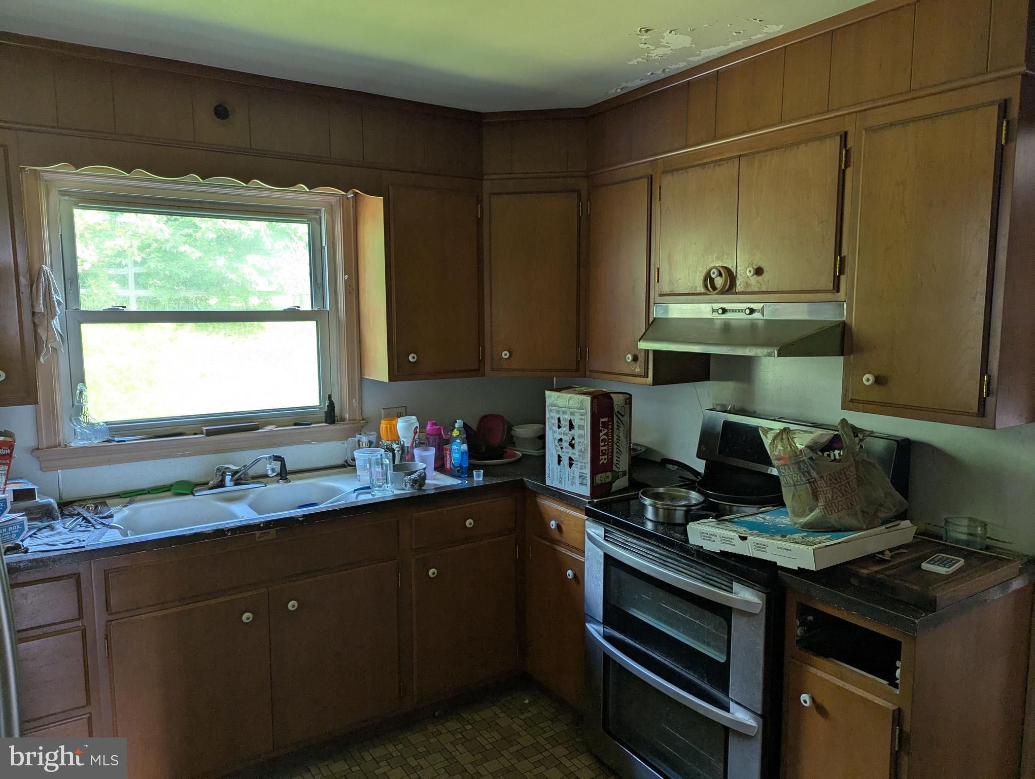 44 Chestnut Street Adamstown, PA 19501 - Photo 4 of 24 a kitchen with sink a stove and cabinets